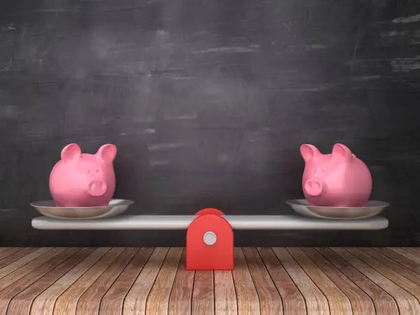 Photo of Seesaw Scale with Piggy Banks on Chalkboard Background - 3D Rendering