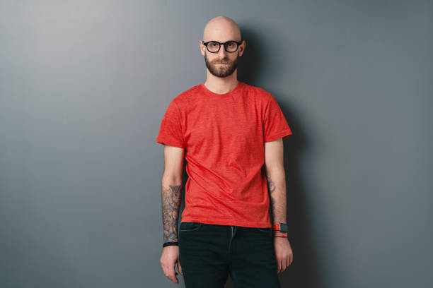 istock Stylish young man posing in the studio on gray background 1098256980
