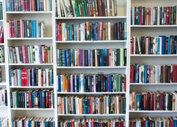istock Blurred image of colorful bookshelf In secondhand shop. 1098258380