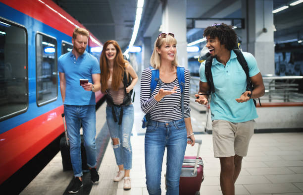 istock Group of young adults boarding a train. 1098258508