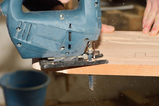 istock carpenter working with plane on wooden background 1098261144