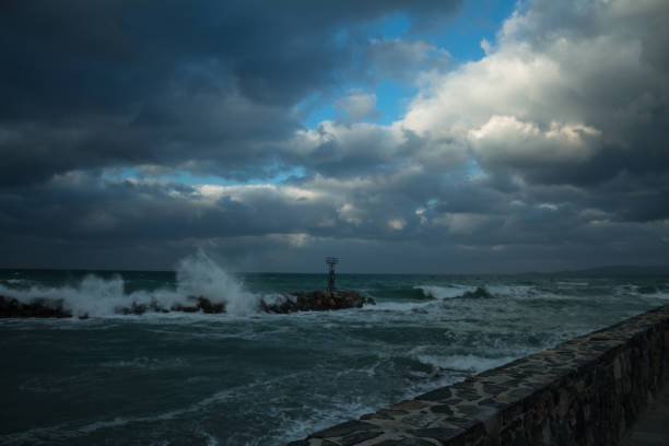 istock strong wind clouds and crushing waves coastal road 1098262020