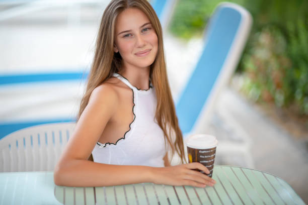 istock Pretty woman in outdoors cafe 1098264560
