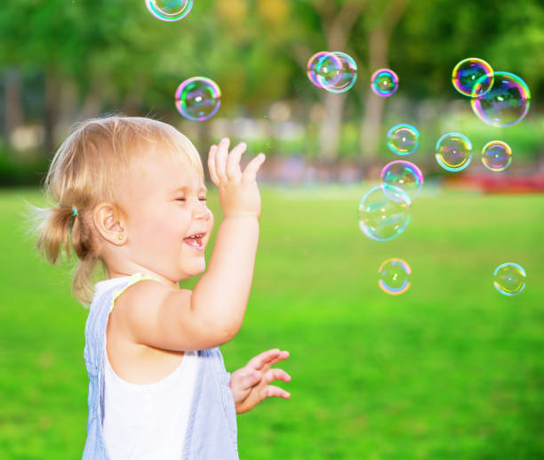 istock Happy child having fun in the park 1098264656