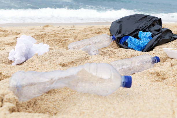 istock Plastic trash at the sandy beach. Plastic pollution concept. Single-use plastic is a human addiction that is destroying our planet and impacts our waters, sea life and humans. 1098265102