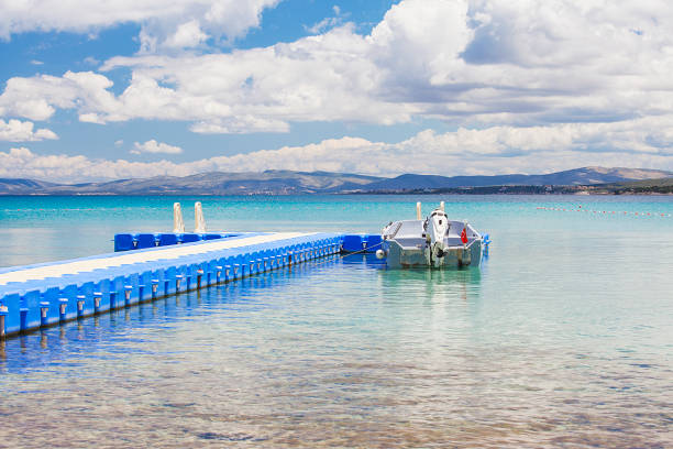 istock Wooden pier at the beach on a sunny day. 1098267352