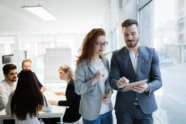 istock Business colleagues collaborating and discussing project plans 1098267914