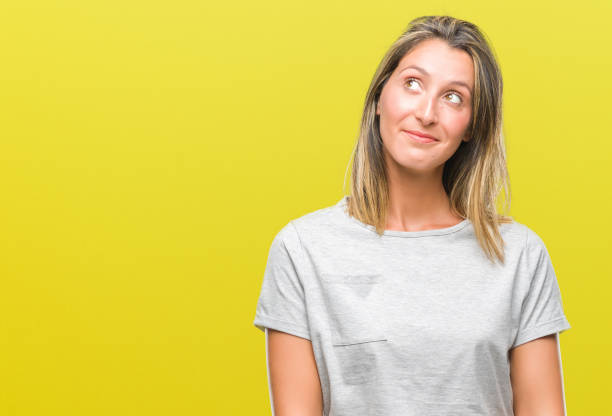 istock Young beautiful woman over isolated background smiling looking side and staring away thinking. 1098272664
