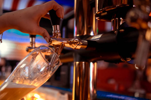 istock close-up beer tap pouring a draught lager beer 1098276930