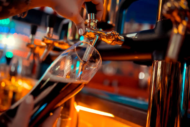 istock close-up beer tap pouring a draught lager beer 1098277388