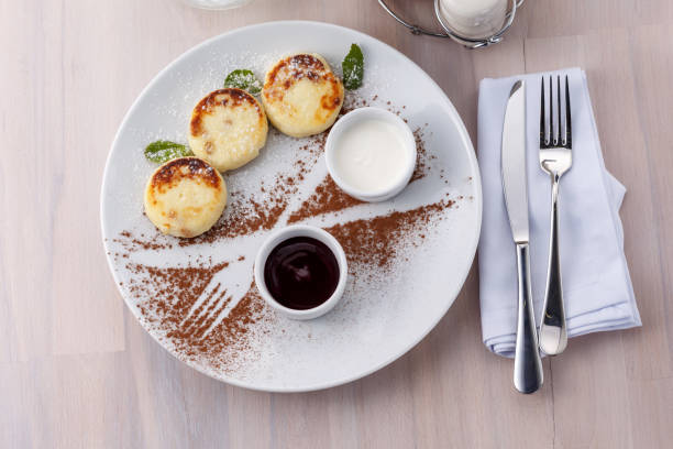 istock Cheese pancakes on plate top view flatlay 1098282184