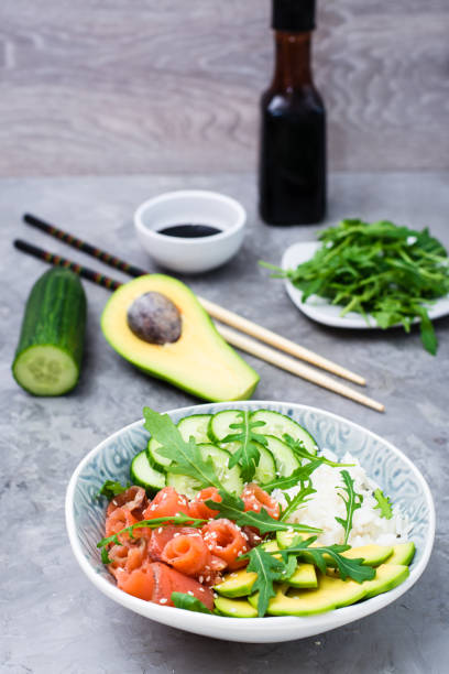 istock Salmon poke with avocado, arugula and cucumber 1098285316