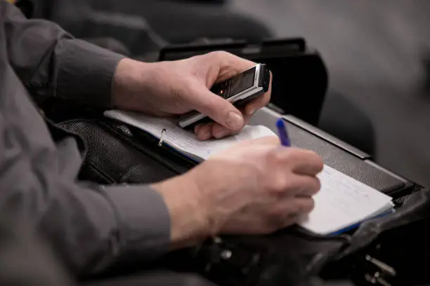 Journalist and camera man with microphone and recorder on smartphone application Interviewing businessman, politician