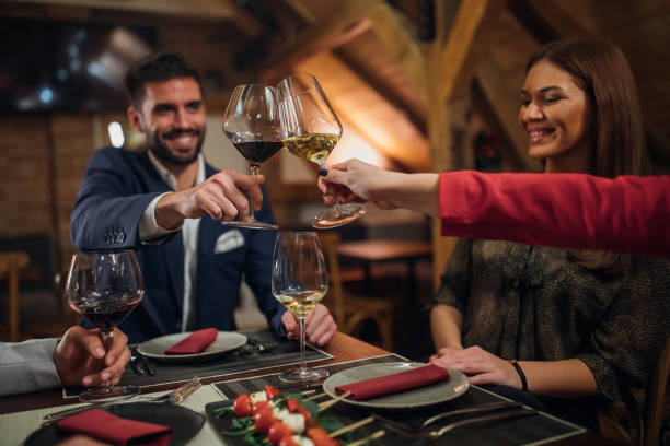 istock Beautiful people drinking wine in restaurant 1098287206