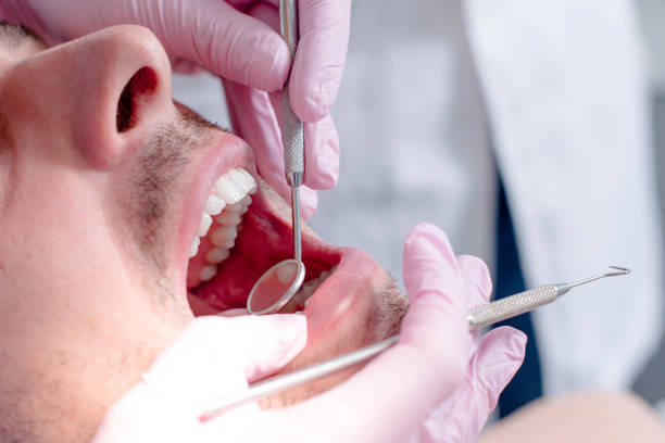 istock Dentist examining a patient's teeth in the dental office. 1098287214