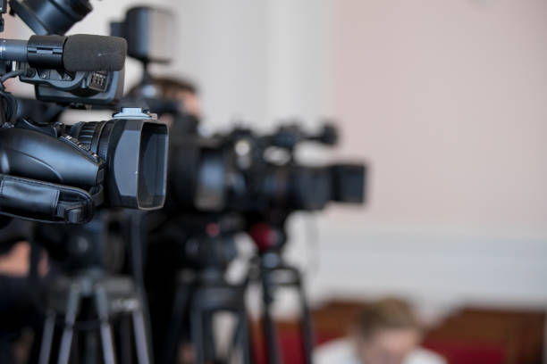 istock Covering an event with a video camera. 1098287228