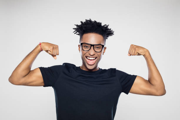 istock Excited afro american man flexing muscles 1098287378