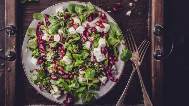 istock fresh winter salad with pomegranate seeds, lamb's lettuce and radicchio 1098289708