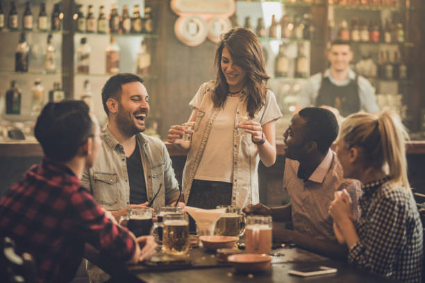 istock Happy friends talking while enjoying in a bar. 1098291256