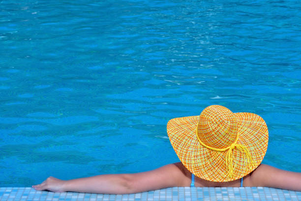 istock Real female beauty relaxing in swimming pool 1098293110
