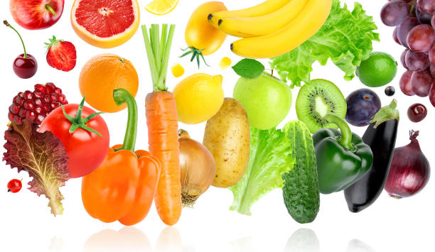istock Falling of fruits and vegetables on white background 1098294922