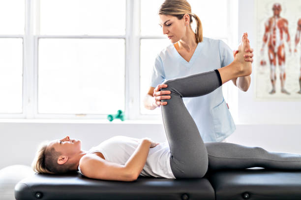 istock A Modern rehabilitation physiotherapy worker with woman client 1098297556