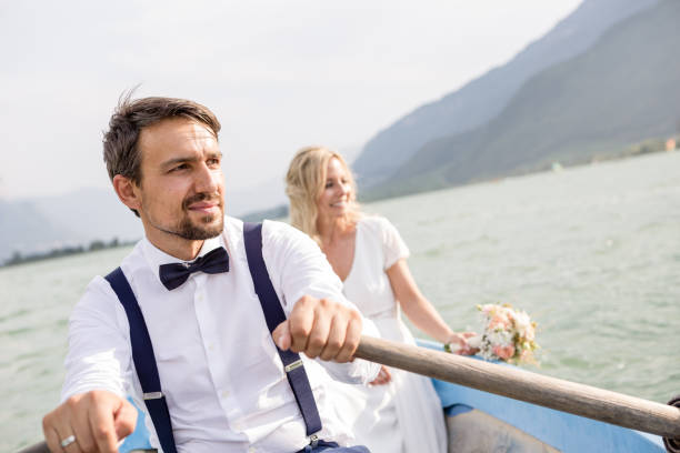 istock Wedding couple with a rowboat 1098299242