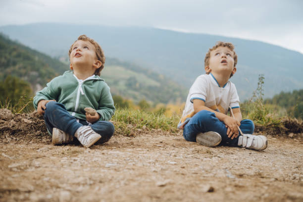Brothers playing outdoors