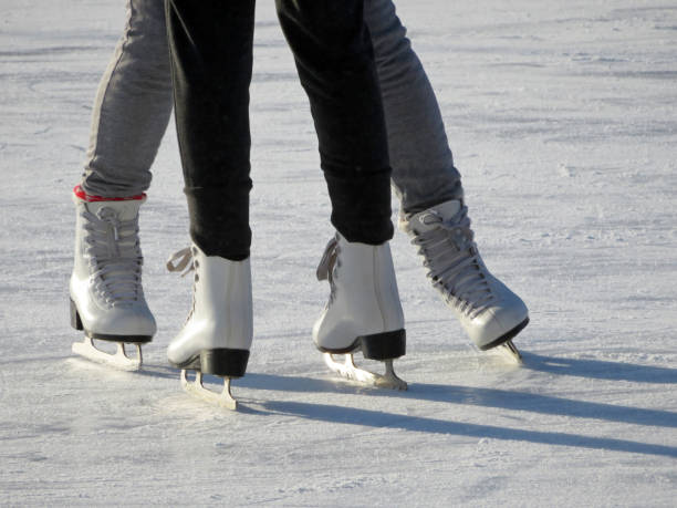 istock Couple riding on the skates, ice skating 1098307654