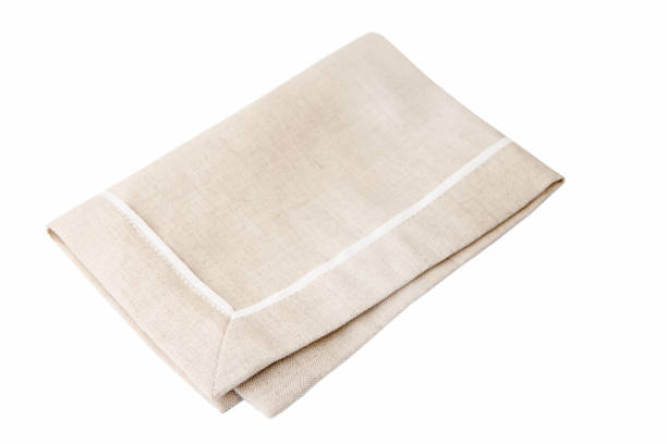 istock Beige fabric napkin isolated on a white background. 1098311162