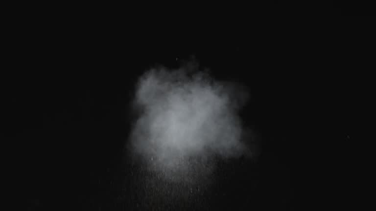 Dusty bullet hits on a wall, white powder explosion VFX elements.