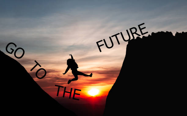 istock creative idea concept  People jumping over the mountains 1098313104