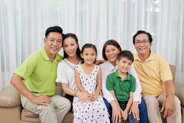 istock Multi-generational Asian family gathering on sofa 1098313338