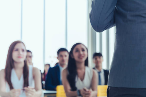 istock Asian Business men trainer giving presentation at conference 1098314078