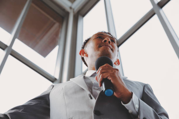 istock Asian Business men trainer giving presentation at conference 1098314080