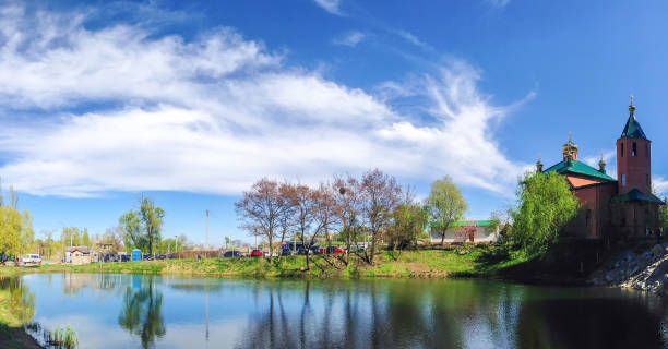 istock St. Nicholas Church near the pond on a sunny day. Panoramic view 1098314316