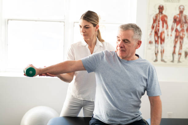 istock A Modern rehabilitation physiotherapy worker with senior client 1098314696