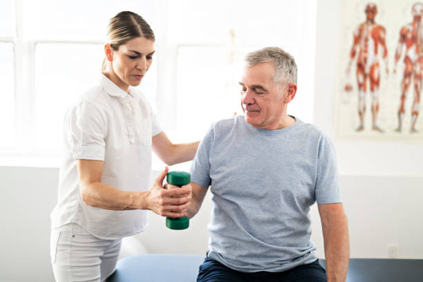 istock A Modern rehabilitation physiotherapy worker with senior client 1098314732