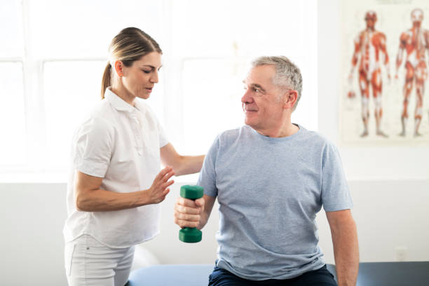 istock A Modern rehabilitation physiotherapy worker with senior client 1098314736
