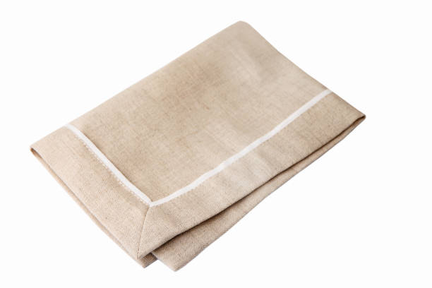 istock Beige fabric napkin isolated on a white background. 1098315102