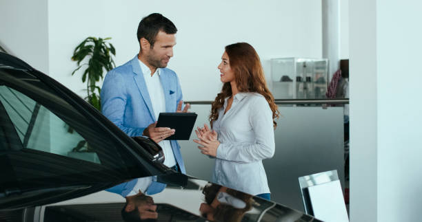istock Car salesman with a customer 1098316390