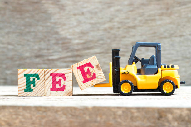 Old orange manual hand pallet trucks. Close up wheel of hydraulic hand pallet truck.