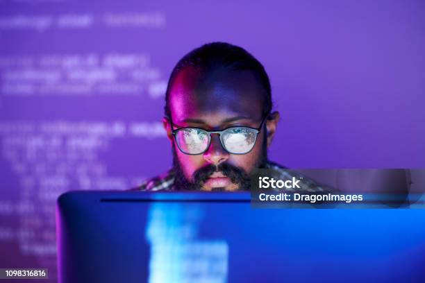 Programmer In Front Of Monitor Stock Photo - Download Image Now - Computer Programmer, Web Designer, Security