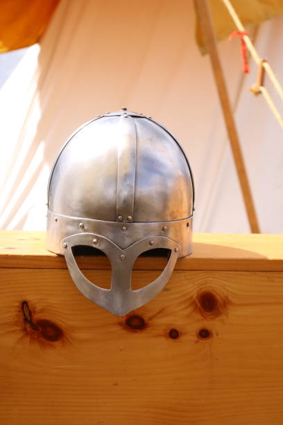Knight metal helmet on spears background