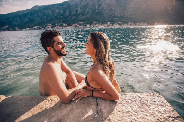 istock Sexy young couple on the beach having fun 1098324068