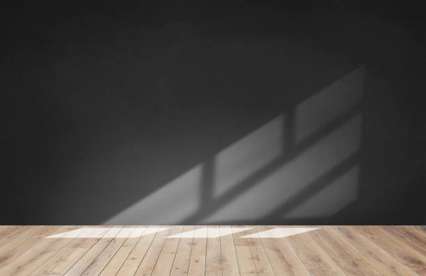 istock Black wall in an empty room with wooden floor 1098326806