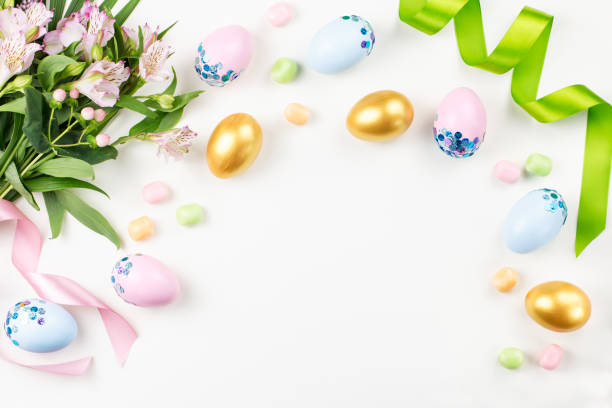 istock Festive Easter background with decorated eggs, flowers, candy and ribbons in pastel colors on white. Copy space 1098328624