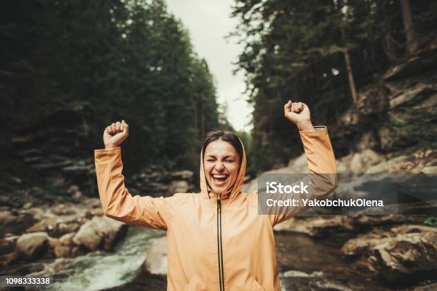 Waist Up Of A Jubilant Young Woman Enjoying Forest Environment Stock Photo - Download Image Now