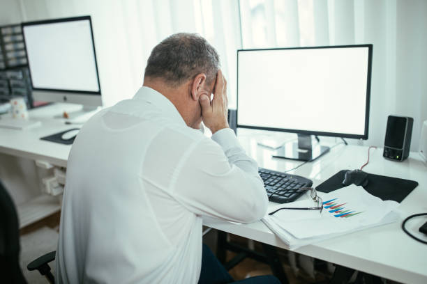 istock Frustrated businessman sitting at the office 1098337328