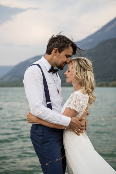 istock Beautyful wedding couple cuddling 1098337650